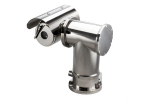 A rugged, industrial-grade Pan-Tilt-Zoom (PTZ) camera featuring a polished stainless steel or chrome-finished explosion-proof housing, equipped with a protective sunshield and specialized lens for high-risk surveillance environments.