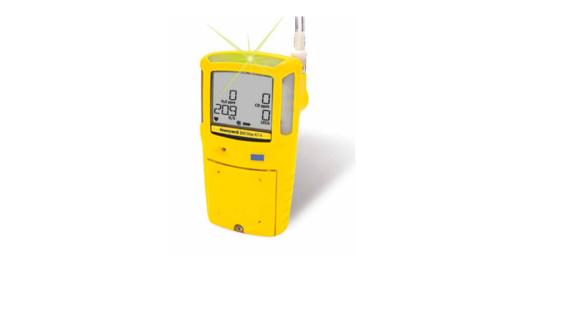 Honeywell BW Max XT II multi-gas detector in a rugged yellow housing, showing a digital LCD display with active gas readings and a flashing green IntelliFlash compliance light at the top.