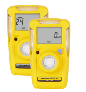 Two yellow Honeywell BW Clip single-gas detectors side-by-side, displaying digital gas readings on LCD screens against a white background.