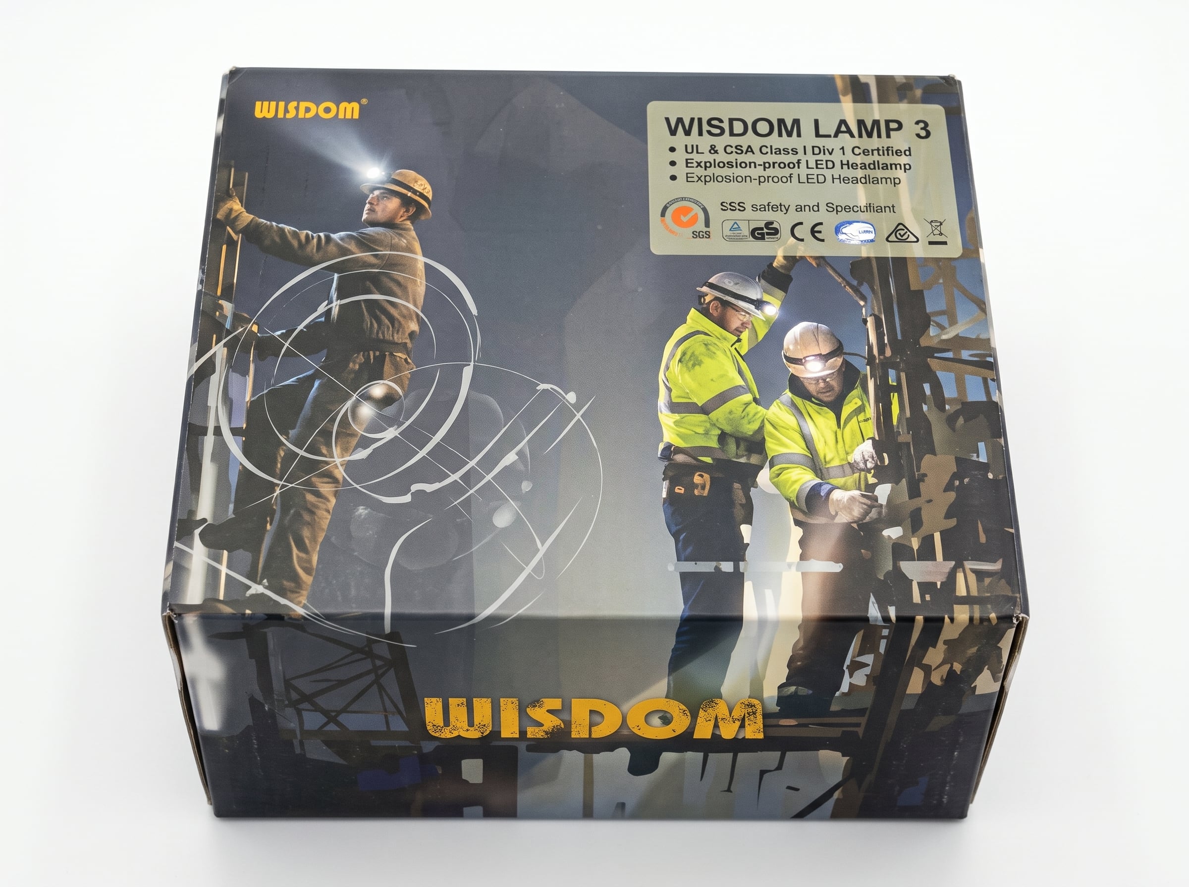 Wisdom Lamp 3 packaging box showcasing UL and CSA Class I, Division 1 explosion-proof certification details, featuring industrial workers wearing safety gear and headlamps on a worksite, centered on a clean white background.