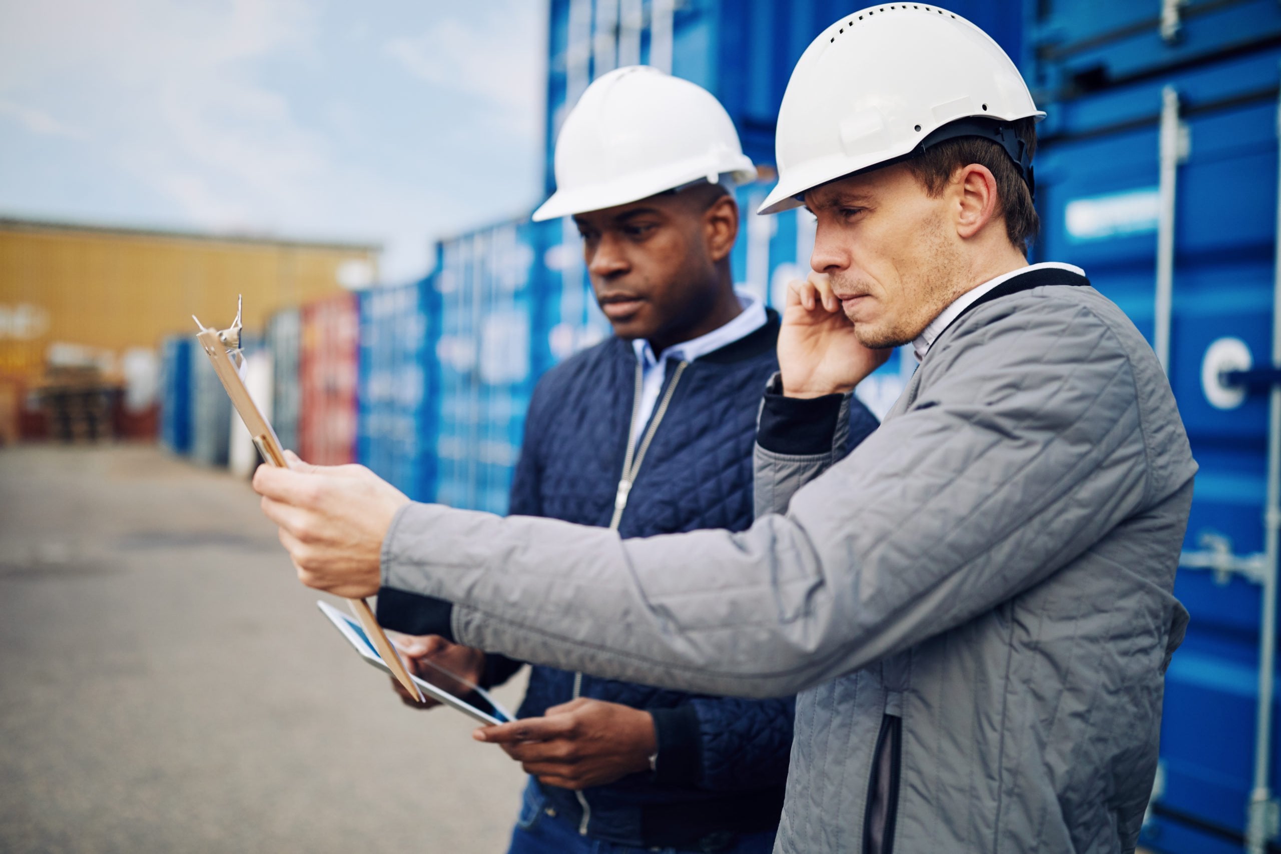 Engineers at work in a large commercial shipyard